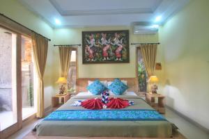 Letto o letti in una camera di The Suci Sari Ubud