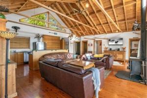 a living room with a couch and a table at Narrow Neck Lodge in Katoomba