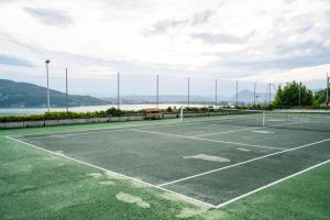 an image of a tennis court with the water at CABANA & Sunset #2 - Terrasse, Parking & Lac in Veyrier-du-Lac +7 photos
