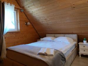 Postel nebo postele na pokoji v ubytování Domek Gościnny
