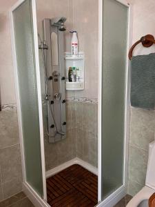 a shower with a glass door in a bathroom at Apartamento Carboneras playa - 2 Habitaciones in Carboneras