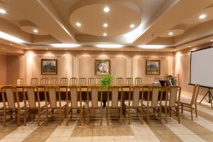 a conference room with a long table and chairs at Hotel Panorama in Veliko Tŭrnovo +34 photos
