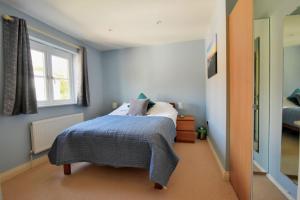 Un pat sau paturi într-o cameră la Anning's View