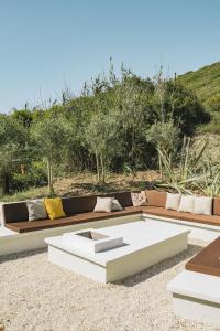 a living room with a couch and a table at Luxury Beach Villa in Ericeira