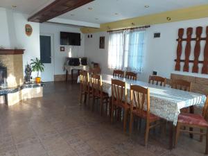 a dining room with a table and chairs at Vacation Home Yoanna in Tryavna