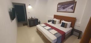 Katil atau katil-katil dalam bilik di Hotel Kandyan View ''Free pickup from Kandy city''