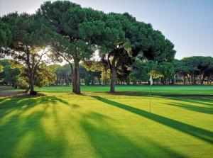 a golf course with trees and a putting green at Rez de jardin au calme et proche mer in Mandelieu-la-Napoule