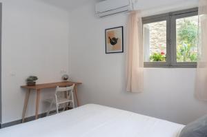 Postel nebo postele na pokoji v ubytování Dioskouros Hostel