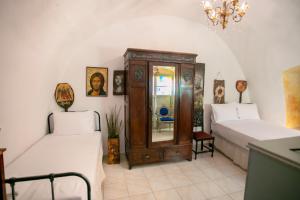 Posteľ alebo postele v izbe v ubytovaní Charouda country house