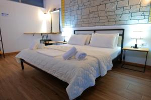 A bed or beds in a room at Oceanic Overview Suites