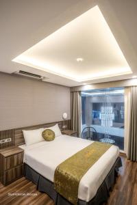 Giường trong phòng chung tại 3T Hotel Hanoi