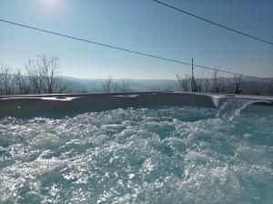 a bath tub filled with water with at Logis de Chalons en Périgord in Domme