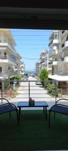 a view of a patio with a table and two chairs at Perea white suites in Perea