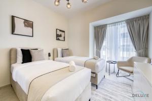 Postel nebo postele na pokoji v ubytování Elegant 2BR at Elite Residences Dubai Marina by Deluxe Holiday Homes