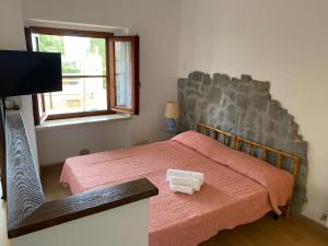 Postel nebo postele na pokoji v ubytování Agriturismo TERRANERA + 37 fotografií