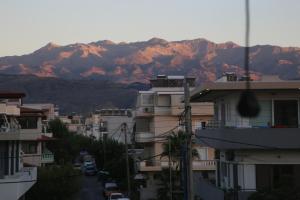 a view of a city with mountains in the background at THALIA APARTMENTS CHANlA in Chania Town