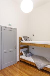 Postel nebo postele na pokoji v ubytování Dioskouros Hostel