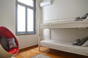 Postel nebo postele na pokoji v ubytování Dioskouros Hostel