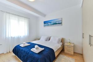 Ένα ή περισσότερα κρεβάτια σε δωμάτιο στο Villa Solis ZadarVillas +43 φωτογραφίες