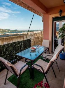 a table and chairs on a patio with a view at STEFANOS HOUSE in Argostoli