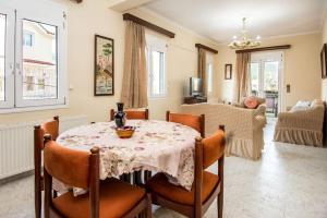 a dining room with a table and chairs at STEFANOS HOUSE in Argostoli