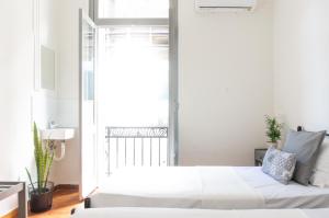 Postel nebo postele na pokoji v ubytování Dioskouros Hostel