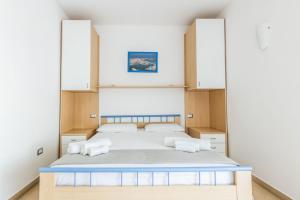 a bedroom with a large bed with two pillows at le terrazze sul mare gallipoli in Gallipoli