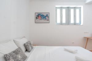 Postel nebo postele na pokoji v ubytování Dioskouros Hostel