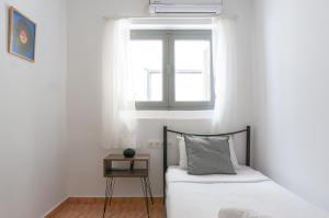 Postel nebo postele na pokoji v ubytování Dioskouros Hostel