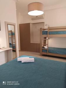 Postel nebo postele na pokoji v ubytování Hotel Maria