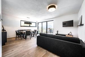 a living room with a couch and a table at Mountain Moments in Sautens