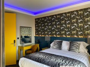 a bedroom with a king sized bed with a purple ceiling at Crown Quarter in Wexford