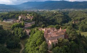 an aerial view of a village in the hills at Il Borro Relais & Châteaux in San Giustino Valdarno