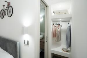a bedroom with a closet with a bike in it at Meraviglia d'Otranto in Otranto +37 photos