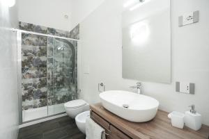 a bathroom with a sink and a toilet and a shower at Meraviglia d'Otranto in Otranto