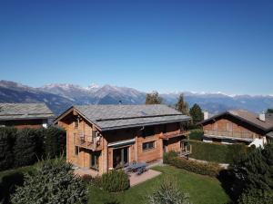 an aerial view of a house with mountains in the background at Chalet CALIN NEND100 in Nendaz