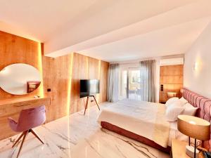 a hotel room with a bed and a mirror at Luxury Villa Barbati Sun with private pool by DadoVillas in Barbati