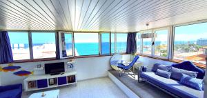 a living room with a view of the ocean at Puerto San Telmo Beach in Puerto de la Cruz