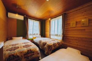 Ένα ή περισσότερα κρεβάτια σε δωμάτιο στο Noasobi Lodge 201- Vacation STAY 45770v