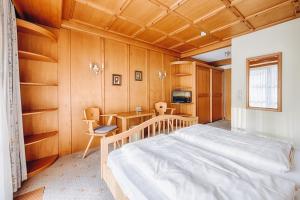 Postel nebo postele na pokoji v ubytování Hotel Garni Nuss