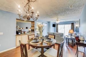 a dining room and living room with a table and chairs at Coastal Compass in Myrtle Beach