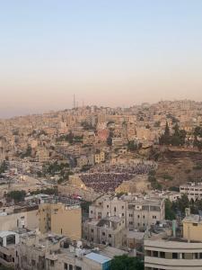 an aerial view of a city with buildings at The Castle Star in Amman
