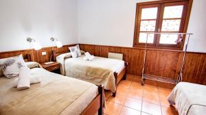 Postel nebo postele na pokoji v ubytování HolidaynorthTenerife Caserío Rural Los Charcos