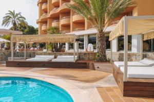 a hotel with a swimming pool and a resort at Marins Beach Club - Adults Only Hotel in Cala Millor