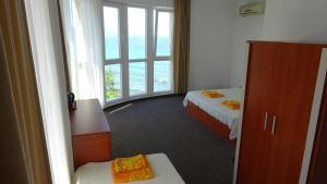 Ένα ή περισσότερα κρεβάτια σε δωμάτιο στο Dobrevi Guest House