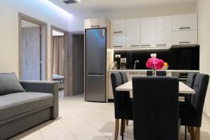 a kitchen and living room with a table and chairs at Gramvoussa Bay in Kissamos