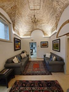 A seating area at Casa Santa Maria - Beautifully restored house in centro storico Irsina Basilicata Puglia