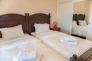 A bed or beds in a room at Villa Sotiris