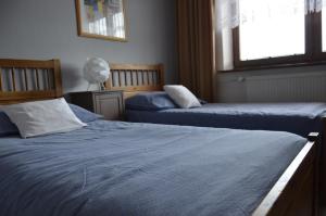 Säng eller sängar i ett rum på Penzion Eva