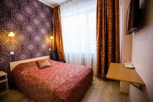 Postel nebo postele na pokoji v ubytování Citystop Majutuskeskus